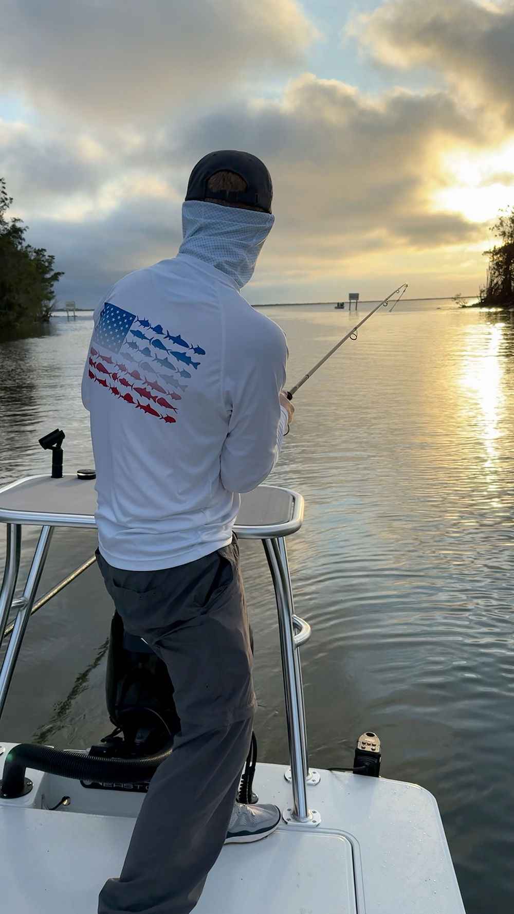 Working a fish at sunrise aboard the Line of Sight skiff