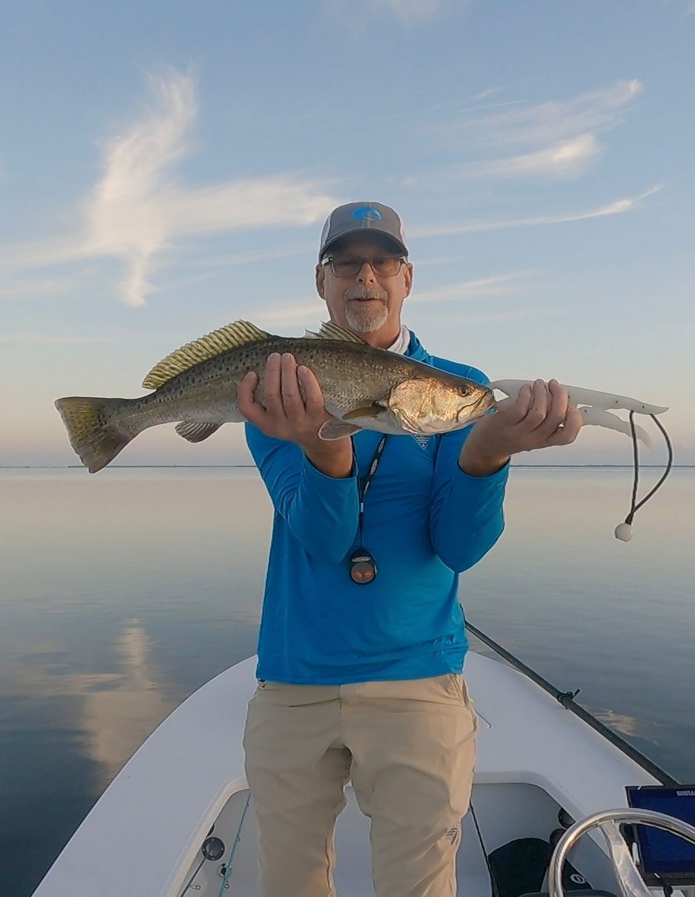 Angler with a seatrout on the Mosquito Lagoon